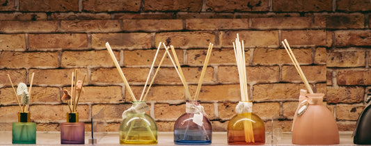 A row of bottles with sticks sticking out of them