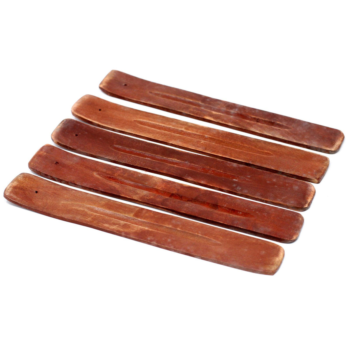 Five natural Palo Santo wood sticks for incense and aromatherapy on a white background