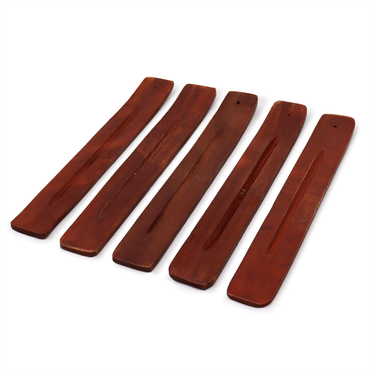 Five brown wooden incense holders arranged diagonally on a white background