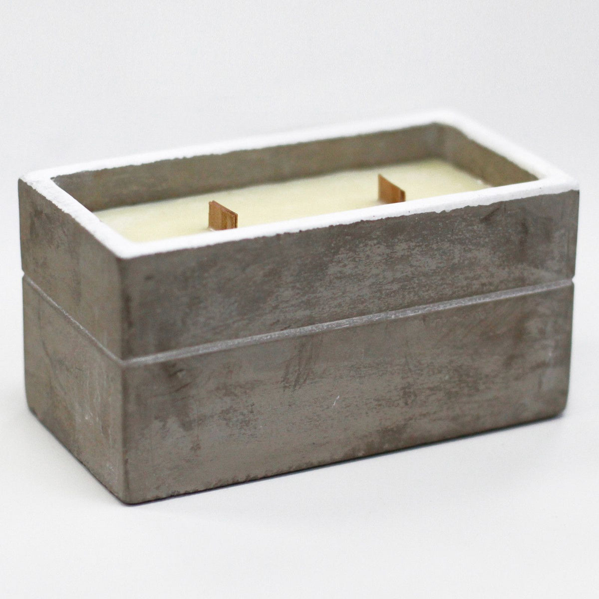 Rectangular concrete candle holder with white wax and two wooden wicks